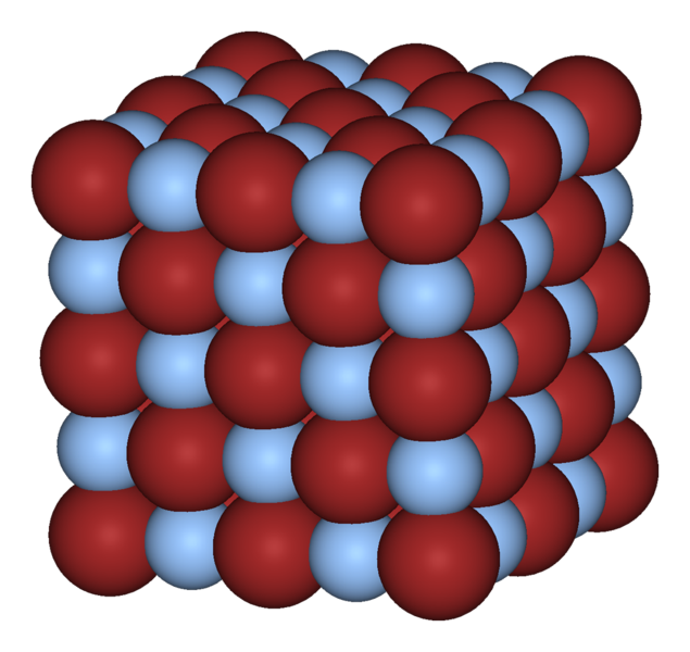 Figure 2 - The crystal structure of silver bromide.  The silver atoms are the red spheres the bromide atomes are the pale blue spheres.  Form the Wikicommons and in the public domain.