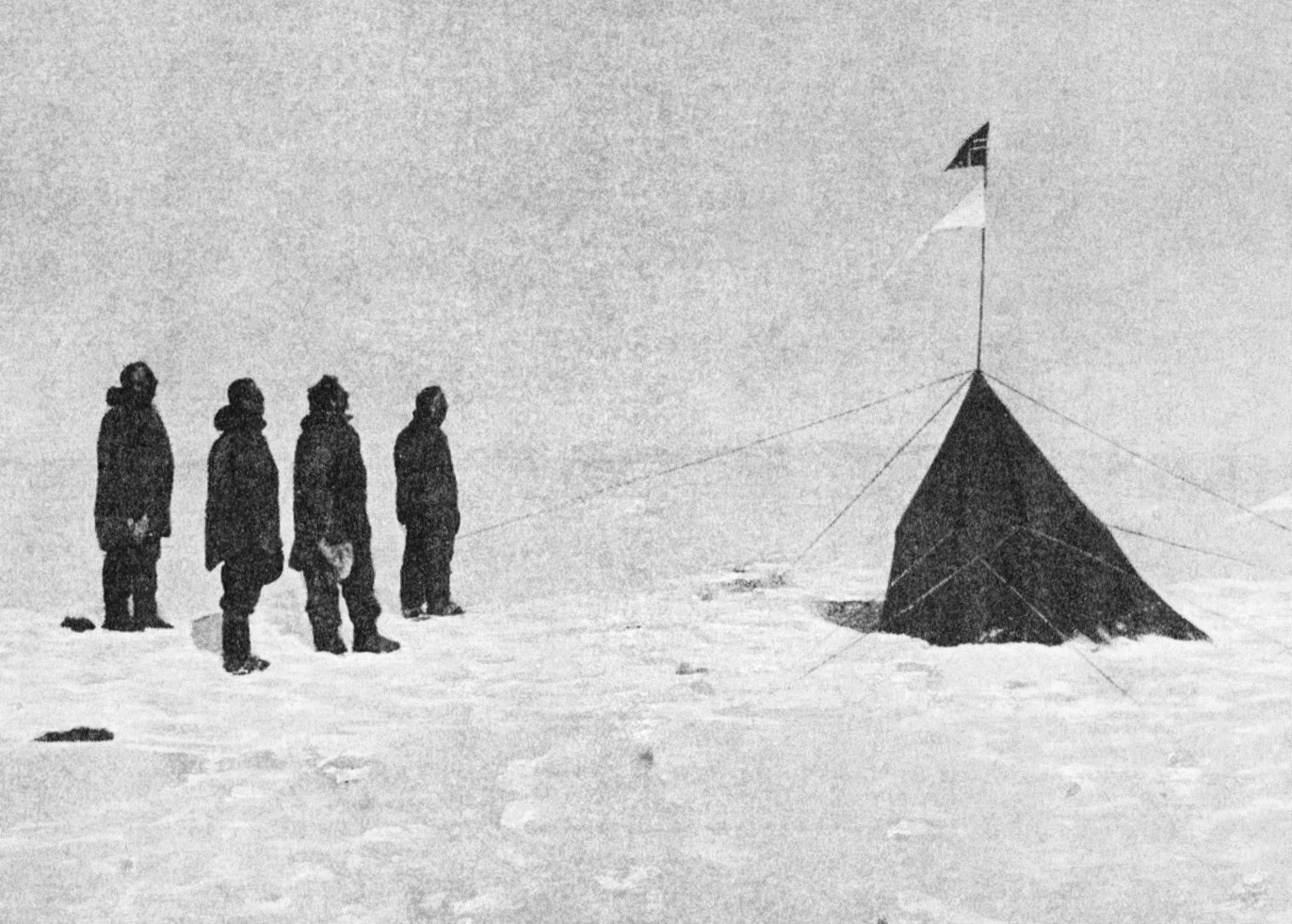 Figure 1 - Roald Amundsen, Helmer Hanssen, Sverre Hassel and Oscar Wisting (l–r) at the South Pole standing before "Polheim", the tent erected at the South Pole on 16 December 1911. Photograph by Olav Bjaaland, the fifth team member.  Originally published in Amundsen's "The South Pole."  From the Wikicommons and in the public domain.