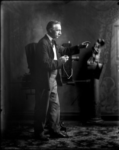 Figure 1 - Photographer of Oscar Grossheim, in his Muscatine, Iowa studio around 1910. From the Wikimedia Commons. Original image from the Musser Library and in the public domain.