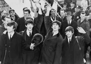 Figure 1 - The Beatles waving to fans on their arrival at JFK Airport in New York City on Feb. 7, 1964.  UPI photograph, photographer unknown, from the LOC via the Wikimediacommons and in the public domain. 